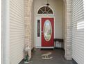 Inviting front entrance with a decorative red door and unique architectural details at 347 Kessinger Dr., Surfside Beach, SC 29575