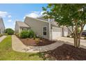 Side view of a well-maintained home with a lush lawn and inviting landscaping at 4359 Livorn Loop # 4359, Myrtle Beach, SC 29579