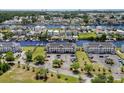 An aerial view of two cream-colored condominium buildings near a waterfront community at 4524 N Plantation Harbour Dr. # B3, Little River, SC 29566