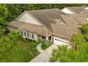 Well-maintained single-story home with mature landscaping, a two-car garage, and a welcoming entrance at 475 Misty Hammock Dr. # 475, Murrells Inlet, SC 29576