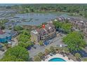 Aerial view of the condo complex shows the surrounding water, landscaping, and a red location marker at 501 Maison Dr. # G-7, Myrtle Beach, SC 29572