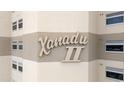 Condo sign Xanadu II in a tan two tone color and surrounded by several windows at 5800 N Ocean Blvd. # 405, North Myrtle Beach, SC 29582