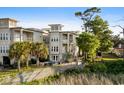 Coastal home with outdoor patio space, including a refreshing private pool, lush landscaping, and coastal charm at 600 48Th Ave. S # 201, North Myrtle Beach, SC 29582