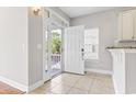 Bright foyer with tiled floor and an open view to the outdoors at 616 S Palmetto Way, Surfside Beach, SC 29575