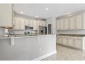 Spacious kitchen featuring white cabinets and granite countertops at 616 S Palmetto Way, Surfside Beach, SC 29575