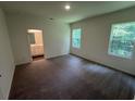Spacious bedroom with plush carpet, large windows, and an en-suite bathroom at 642 Muster Field Ct., Conway, SC 29526