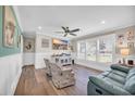 Bright living room features luxury vinyl floors, white trim and comfortable furnishings at 1014 Thomas Ave., North Myrtle Beach, SC 29582