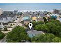 Charming coastal neighborhood with colorful homes near the beach, offering a serene seaside lifestyle at 113 Woodland Dr., Murrells Inlet, SC 29576