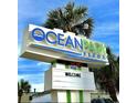 Ocean Park Resort sign, palm trees, and blue sky on a clear day at 1905 S Ocean Blvd. # 922-924, Myrtle Beach, SC 29577
