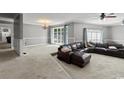 Open-concept living room with cozy seating, chandelier, and a seamless flow at 3173 Long Avenue Ext., Conway, SC 29526
