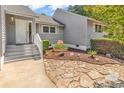 A quaint entrance with a beautifully landscaped yard and stone walkway at 4339 Baldwin Ave. # 4339, Little River, SC 29566