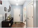 Inviting entryway with hardwood floors and a decorative console table at 436 Cotton Grass Dr., Loris, SC 29569