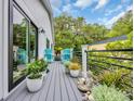 Balcony with outdoor seating, plants, and tranquil garden decor at 476 Lakeshore Dr., Pawleys Island, SC 29585
