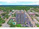 Exterior shot of the condominium building, highlighting balconies and surrounding neighborhood at 601 Mitchell Dr. # 806, Myrtle Beach, SC 29577