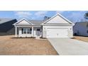 Well maintained one story home with neutral colors, a two car garage and green lawn at 618 Lightwood Dr., Conway, SC 29526