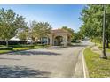 Elegant community entrance with terracotta roof and manicured landscaping welcomes you to your new home at 9485 Ronda Ct., Myrtle Beach, SC 29579