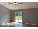 Bright bedroom with sliding glass doors leading to a private backyard at 962 Willow Bend Dr., Myrtle Beach, SC 29579