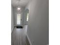 Inviting foyer with a decorative light fixture and wood-look floors throughout at Tbd 7 Duford Rd., Nichols, SC 29581