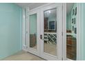 This home features a climate-controlled wine cellar with racks, barrel accents and glass doors at 107 Waterway Crossing Ct., Little River, SC 29566