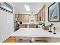 Kitchen with stainless steel appliances and breakfast bar with seating at 17 South Oak Dr., Surfside Beach, SC 29575