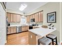 Modern kitchen featuring stainless steel appliances and a breakfast bar at 17 South Oak Dr., Surfside Beach, SC 29575