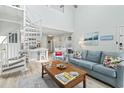 Open-concept living room featuring a spiral staircase, seamless integration of living spaces at 207 Double Eagle Dr. # F-3, Myrtle Beach, SC 29575