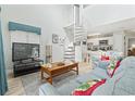 Cozy living room featuring a spiral staircase and open layout to the kitchen at 207 Double Eagle Dr. # F-3, Myrtle Beach, SC 29575