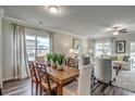 Open dining area with hardwood floors adjacent to the living room, with natural light at 296 Mayflower Dr., Calabash, NC 28467