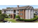 A view of the exterior of an apartment building from the side, showcasing its structure and surrounding greenery at 3795 Hitchcock Way # 618, Myrtle Beach, SC 29577