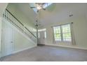 Bright living room offers natural light, high ceilings, and easy access to the staircase and front door at 395 Dunbarton Ln., Conway, SC 29526