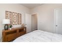 Cozy bedroom with stylish decor, wood furnishings, and a bright, airy atmosphere at 4458 East Coast Ln., Shallotte, NC 28470
