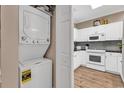 Convenient laundry area beside kitchen includes modern appliances and ample storage space at 4787 Wild Iris Dr. # 303, Myrtle Beach, SC 29577