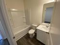 Bright bathroom features a tub, toilet, vanity, and modern fixtures at 620 Muster Field Ct., Conway, SC 29526