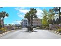 Beautiful Waterway Village entrance with a decorative gate and well-maintained landscaping at 637 Waterway Village Blvd. # 13C, Myrtle Beach, SC 29579