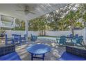 Covered patio with outdoor dining and lounging, perfect for entertaining poolside under the shade at 703 37Th Ave. S, North Myrtle Beach, SC 29582