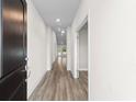 The long hallway has gorgeous wood floors and leads to rooms filled with natural light at 739 Harrison Mill St., Myrtle Beach, SC 29579