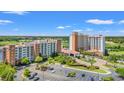 Picturesque aerial view of resort with parking, lush gardens, and waterways offering a tranquil setting at 8121 Amalfi Pl. # 7-604, Myrtle Beach, SC 29572