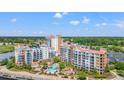 Scenic aerial view of resort featuring pools, spas, and multiple condo buildings surrounded by lush landscaping at 8121 Amalfi Pl. # 7-604, Myrtle Beach, SC 29572