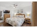 Bedroom with queen bed, ceiling fan, dresser and matching nightstands, creating a cozy space at 9400 Shore Dr. # 507, Myrtle Beach, SC 29572
