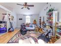 Bright living area featuring hardwood floors, ceiling fan and large sunny window at 9664 Middleton Ct., Murrells Inlet, SC 29576
