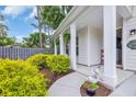 Inviting front porch featuring lush landscaping and decorative touches for a warm welcome at 1009 Oak Marsh Ln., North Myrtle Beach, SC 29582