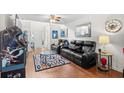 Comfortable living room with plush seating, arcade game, and natural light at 1065 Harvester Circle, Myrtle Beach, SC 29579