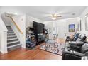 Spacious living room with hardwood floors, staircase, and entertaining area at 1065 Harvester Circle, Myrtle Beach, SC 29579