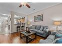 Cozy living room with hardwood floors and comfortable seating area at 112 Olde Towne Way # 5, Myrtle Beach, SC 29588