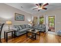 Inviting living area with wood floors and natural light from the back door at 112 Olde Towne Way # 5, Myrtle Beach, SC 29588