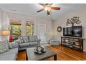 Comfortable living space featuring wood floors and backyard access at 112 Olde Towne Way # 5, Myrtle Beach, SC 29588