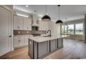 Charming kitchen with custom cabinets, granite countertops, stainless steel appliances, and pendant lighting at 1142 Fiddlehead Way, Myrtle Beach, SC 29579