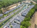 Aerial view of condos with water features, landscaping, parking, and community amenities at 1290 River Oaks Dr. # 7H, Myrtle Beach, SC 29579