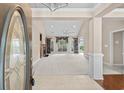 Bright, spacious living room featuring high ceilings, decorative windows, and elegant tile flooring at 1315 Cherry Dr., Surfside Beach, SC 29575