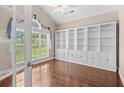Well-lit office featuring custom built-in shelving, hardwood floors, and a large window at 1315 Cherry Dr., Surfside Beach, SC 29575